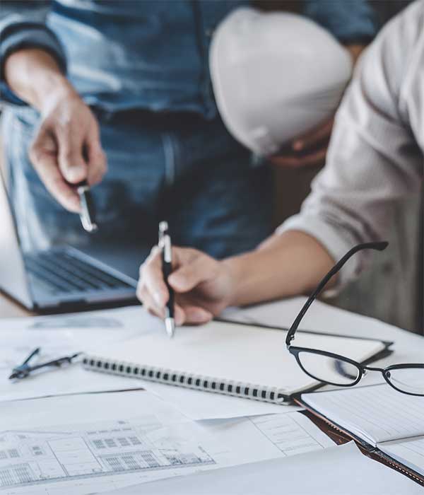 two people studying commercial property inspection reports